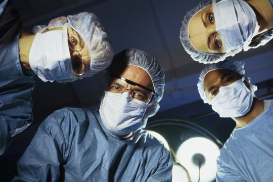 [Surgeons+Looking+at+Patient.jpg]