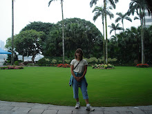 Linda at hotel in front of Palm Trees