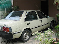 Light green Nissan Sunny 130Y parked at our car porch