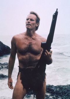 [240px-Heston_as_Taylor_with_gun_standing_on_the_beach.jpg]