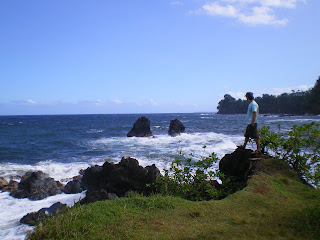 Standing on a rock near the ocean in Hawaii