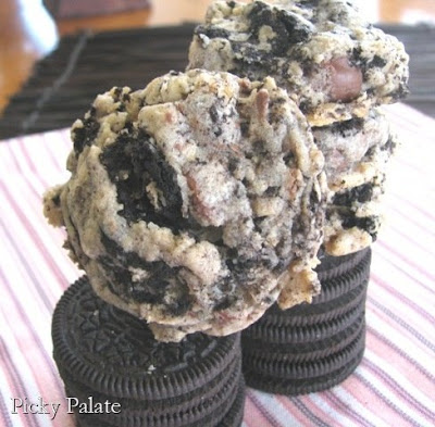 A stack of Oreo cookies topped with Oreo chocolate chip cookies.