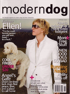 Ellen Degeneres holding a white dog on the cover of Modern Dog